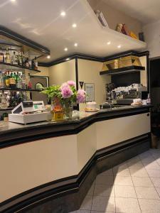 a kitchen with a counter with flowers on it at Locanda L'Ombrosa in Vezzano Ligure