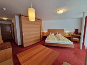 Ένα ή περισσότερα κρεβάτια σε δωμάτιο στο Hotel Mignon