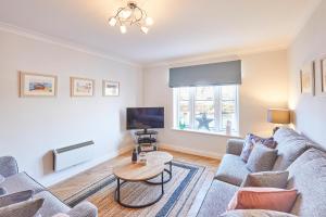 a living room with a couch and a table at Host & Stay - Harbour View in Whitby