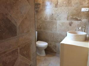 a bathroom with a toilet and a sink at Maison au bord de mer in Saintes-Maries-de-la-Mer +30 photos