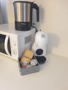 a coffee maker sitting next to a microwave at Residenza Tiziana Venezia in Venice