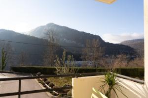 a balcony with a view of a mountain at KASA JURA - Au coeur des monts in Saint-Claude