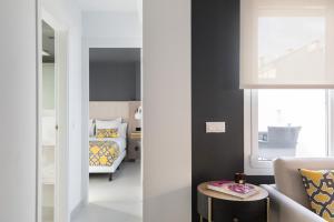 A bed or beds in a room at Apartamentos Las Torres