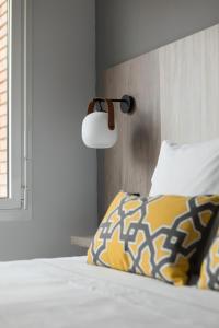 A bed or beds in a room at Apartamentos Las Torres