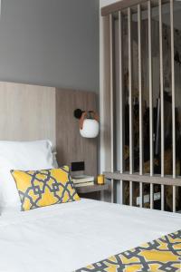 A bed or beds in a room at Apartamentos Las Torres