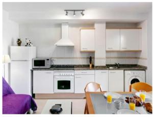 A kitchen or kitchenette at La Riviera Még 4 kép