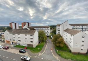 an aerial view of a city with buildings and a street at City Centre Apartment Northampton in Northampton