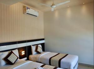 Voodi või voodid majutusasutuse Yuvraj Palace Inn toas