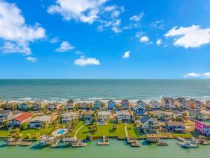 an aerial view of a resort with the ocean at Pet Friendly Beach House! Private Dock On Channel! Private Pool! 5 bedroom - 3 bath! in Myrtle Beach