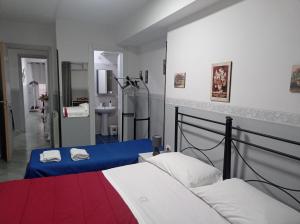 Postel nebo postele na pokoji v ubytování Hotel Alloggio Del Conte