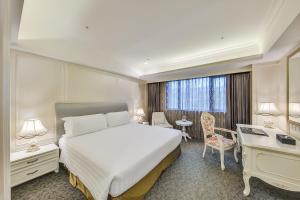 Postel nebo postele na pokoji v ubytování Forte Hotel Xizhi + 34 fotografií