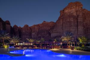 a resort with a mountain in the background at Shaden Resort in AlUla