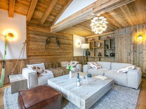 a living room with a couch and a table at Appartement Val-d'Isère, 4 pièces, 6 personnes - FR-1-694-155 in Val-d'Isère