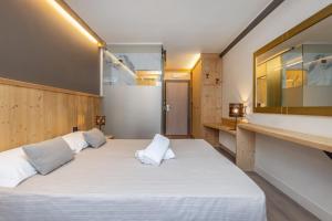 Postel nebo postele na pokoji v ubytování Hotel Piandineve