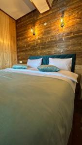 a large bed with two pillows on top of it at Harsnadzor Eco Resort in Halidzor