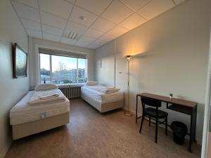 Postel nebo postele na pokoji v ubytování Baron's Hostel