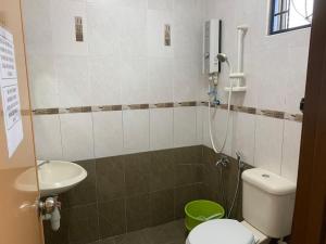 a bathroom with a toilet and a sink at Home in Nilai in Nilai
