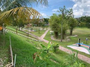 a park with a pool and a playground at Home in Nilai in Nilai