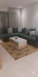 a living room with a couch and a coffee table at Luxury Studio Princess in Casablanca