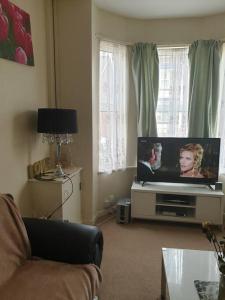 a living room with a tv and a couch at The Havens in Liverpool