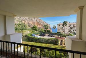 a balcony with a view of a mountain at Oasis Beach in Altea