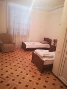 Postel nebo postele na pokoji v ubytování Tbilisi Marjani