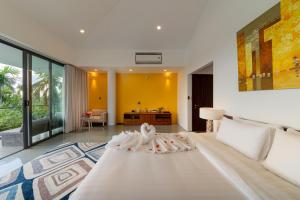 Postel nebo postele na pokoji v ubytování Akala Villa Hoi An