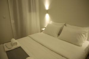 A bed or beds in a room at Aelia Apartment 2 Ioannina