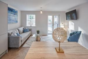 a living room with a couch and a table at Host & Stay - Shipwrights in Whitby