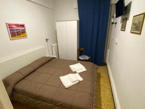 Posteľ alebo postele v izbe v ubytovaní Hotel La Pergola