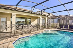 a swimming pool in a house at Modern Haines City Home with Pool and Lanai! in Haines City
