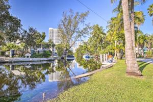 a park with palm trees and a body of water at Fort Lauderdale Condo with Patio, Near Canal! in Fort Lauderdale