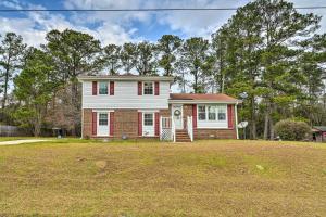 a house with a large yard in front of it at Jacksonville Getaway about 4 Mi to Downtown! in Jacksonville