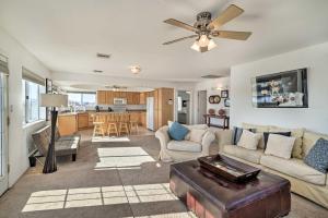 a living room with a couch and a ceiling fan at Magnificent Big River Home with Beautiful Views in Parker