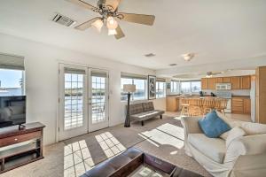 a living room with a couch and a tv at Magnificent Big River Home with Beautiful Views in Parker