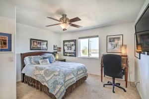 a bedroom with a bed and a ceiling fan at Magnificent Big River Home with Beautiful Views in Parker