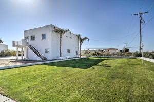 a large lawn in front of a white building at Magnificent Big River Home with Beautiful Views in Parker