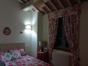 Cama o camas de una habitación en Antico Casale Il Borgo San Martino in Campo