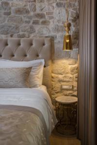Postel nebo postele na pokoji v ubytování Le Premier Luxury Rooms