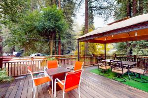 a deck with a table and chairs and a gazebo at River Paradise in Guerneville