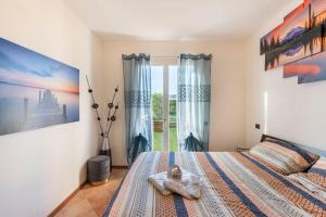 Lova arba lovos apgyvendinimo įstaigoje Oliva Apartment - Featuring a Private Garden and Access to a Pool
