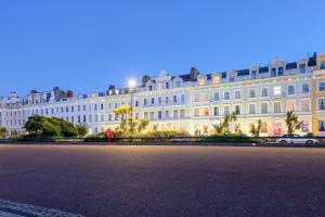 a large white building with a street in front of it at Somerset Hotel in Llandudno