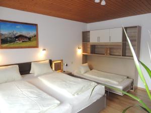 Ein Bett oder Betten in einem Zimmer der Unterkunft Haus Bergfried