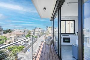 a balcony with a view of a city at Good times by HolyGuest in Tel Aviv
