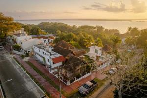 an aerial view of a city with houses and a street at Hotel Miriam Bacalar in Bacalar