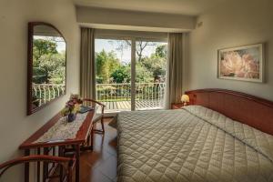 מיטה או מיטות בחדר ב-Hotel Garden Zorzi