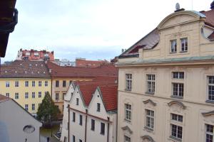 a group of buildings in a city with roofs at Old Town Residence - Konviktská in Prague