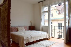 Postel nebo postele na pokoji v ubytování Old Town Residence - Konviktská