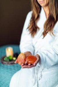 a woman holding a piece of food in her hands at Omni Orlando Resort at Championsgate in Kissimmee