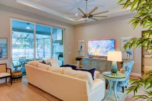 a living room with a couch and a table at Luxury Home in Downtown Sarasota, HTD POOL/Hot tub in Sarasota